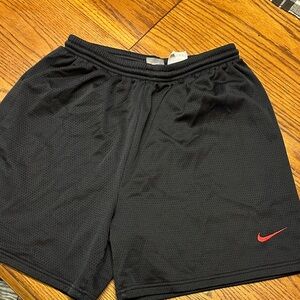 Nike Kids Black Shorts with Red Swoosh